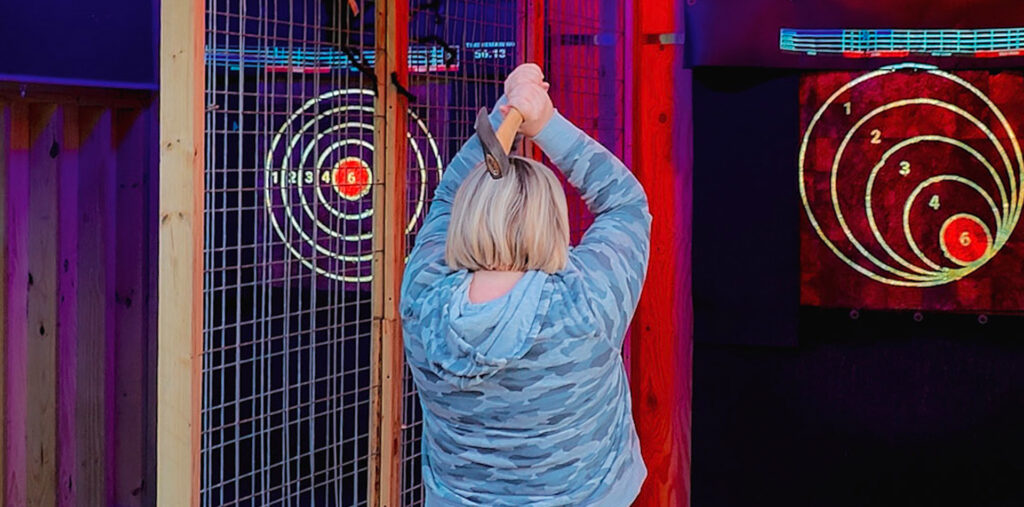 Outdoor axe throwing at The Adventure Park in Sandy Springs, MD