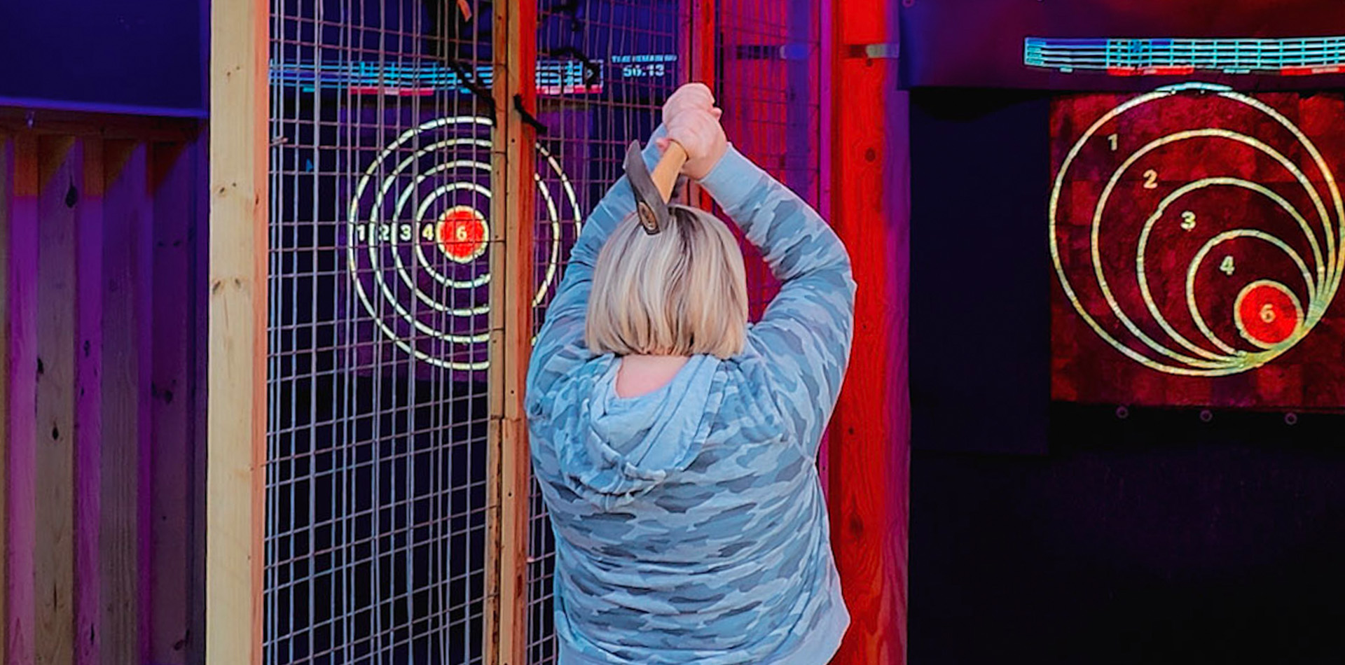 Outdoor axe throwing at The Adventure Park in Sandy Springs, MD